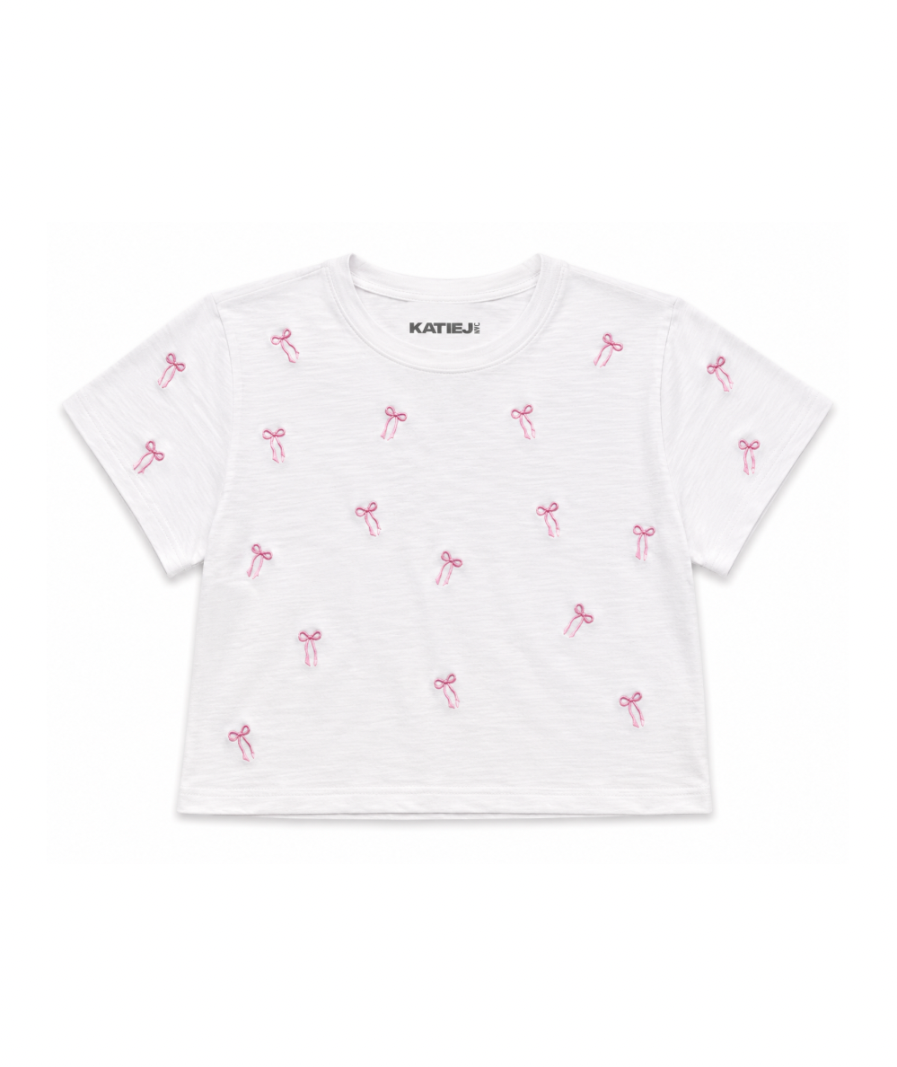 KatieJ NYC Tween Fearless white crop tee with pink embroidered bows, crew neckline, and short sleeves