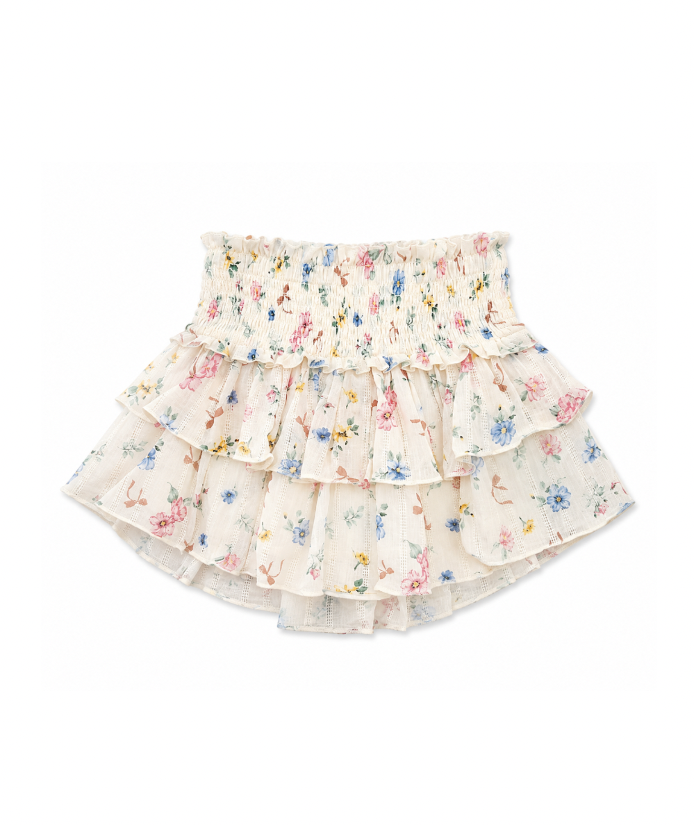 KatieJ NYC Tween Bianca Skirt in Cream Tossed Floral featuring a flowy two-tier silhouette, smocked elastic waistband, and soft floral print. Lightweight boutique skirt for tween girls that pairs perfectly with the matching Marlee Top or cozy fall sweaters.