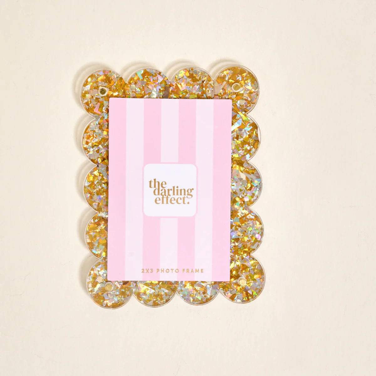The Darling Effect Mini Acrylic Magnet Picture Frame in Gold Glitter with scalloped edges, sized to hold a 2-by-3-inch photo.