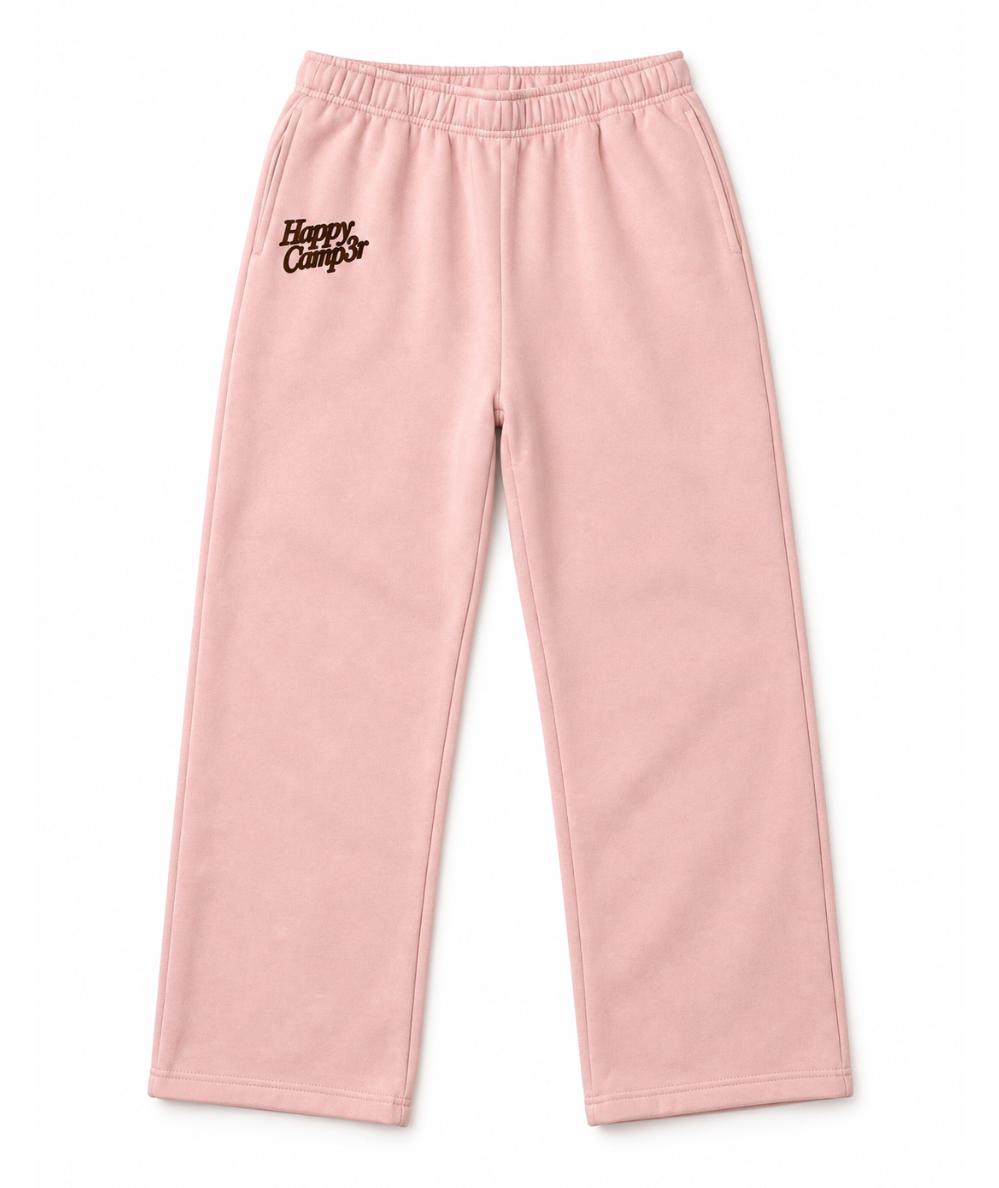 Happy Camp3r Puff Series Core Youth Sweatpants in pink with brown puff lettering along the side and a drawstring waist.