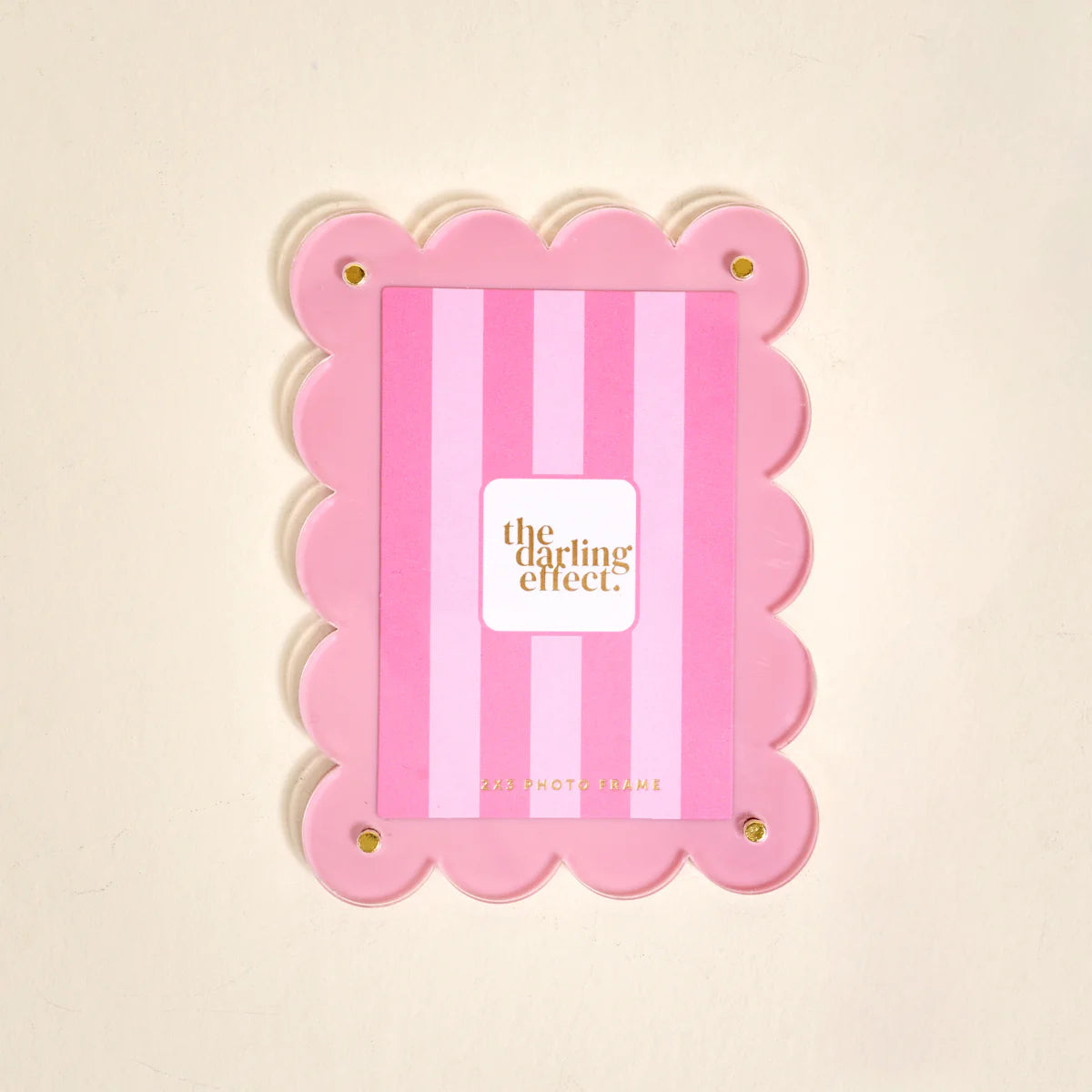 The Darling Effect Mini Acrylic Magnet Picture Frame in Blush hue with scalloped edges, sized to hold a 2-by-3-inch photo.