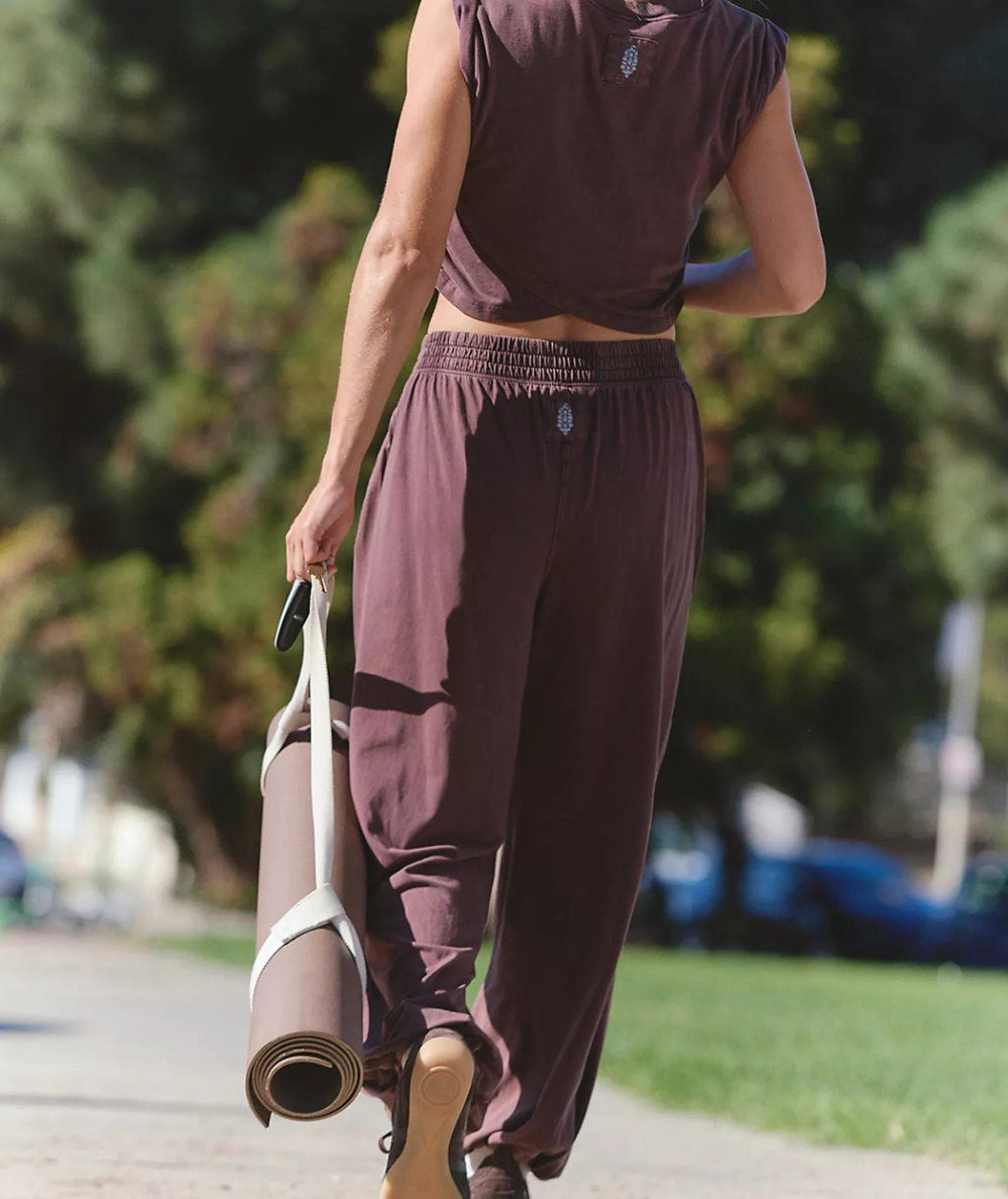 Back view of FP Movement Hot Shot Crossover Set in Dark Espresso showing the cropped top and elastic-waist joggers.