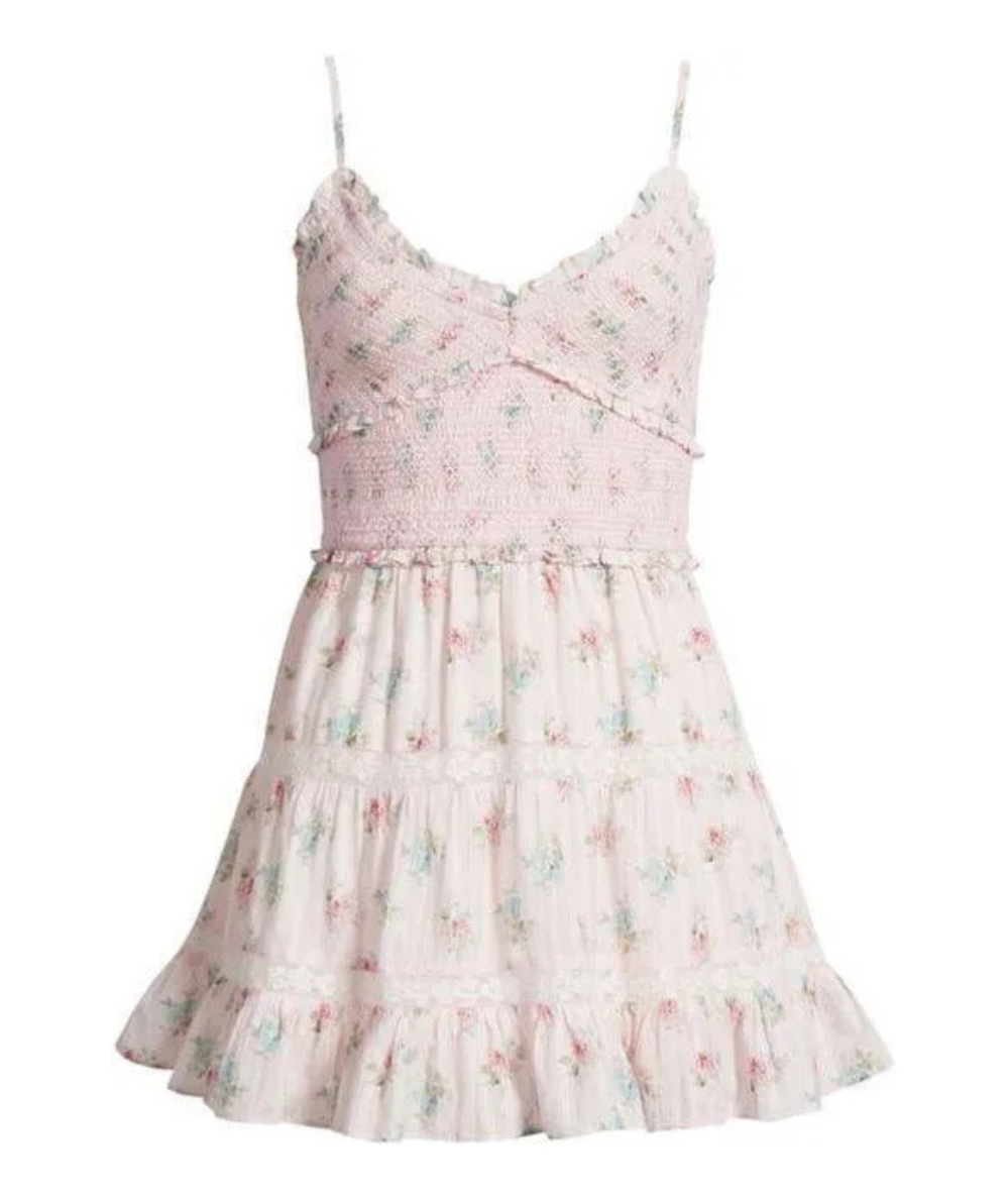 Close up of the fabric on the LoveShackFancy Women’s Lizzy Floral Smocked Mini Dress with a floral print, smocked bodice, V-neckline, and adjustable straps.
