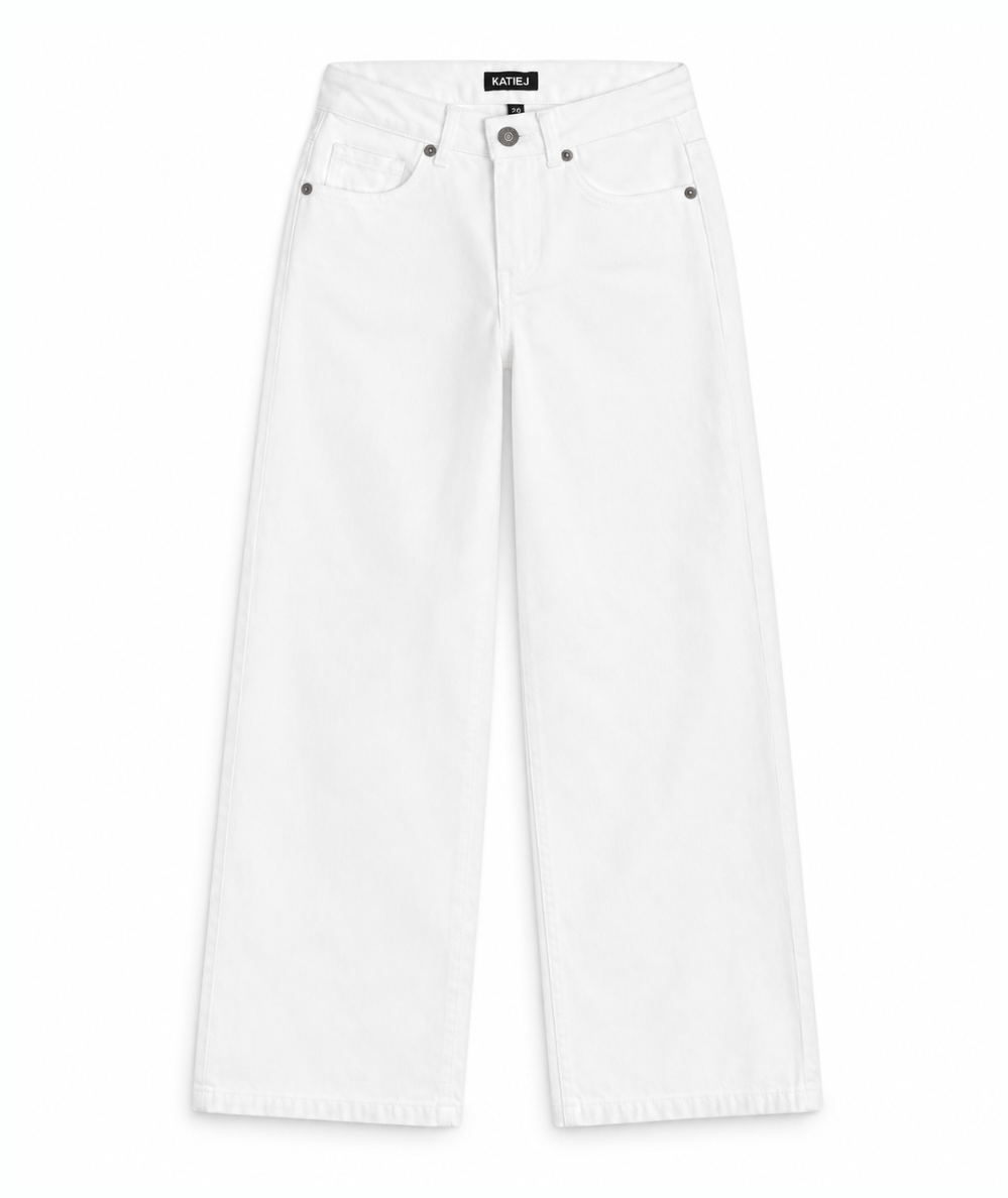 KatieJ NYC Tween Chicago jeans with a low-rise waist, wide legs, and five-pocket styling in white.