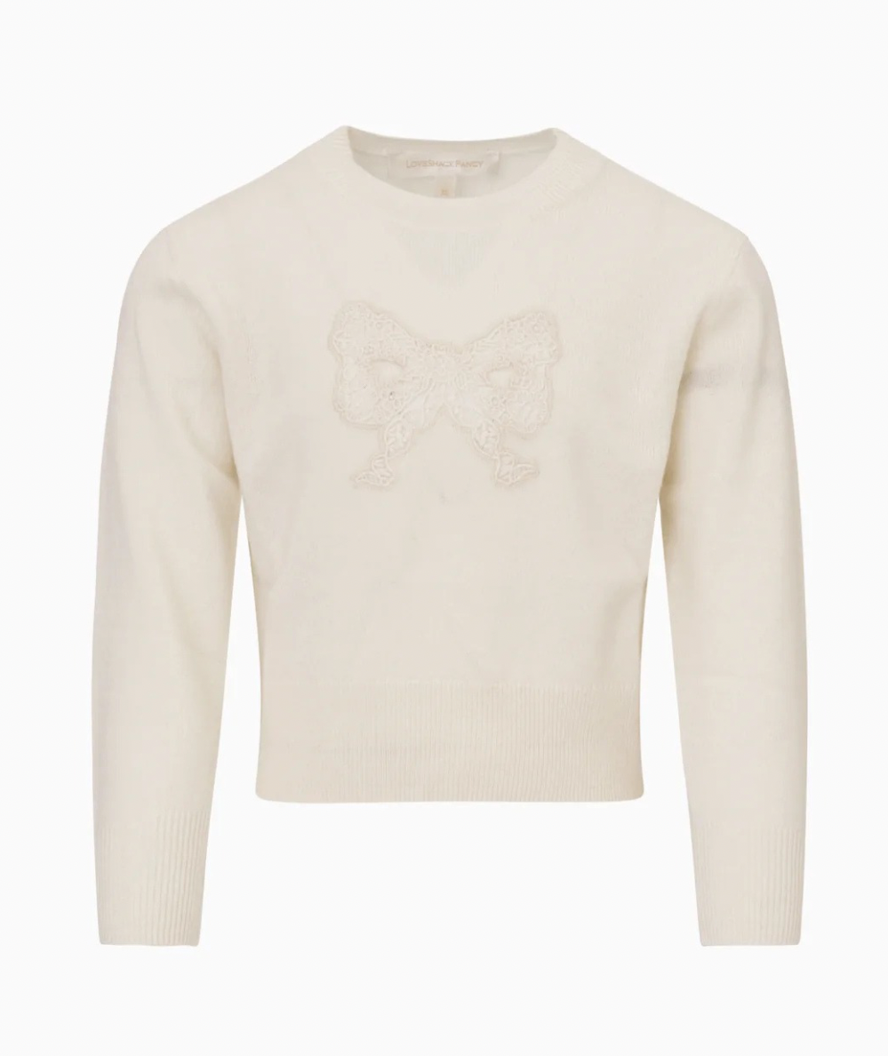 LoveShackFancy Tween Zolee Lace Bow Pullover in Cozy Ivory with tonal lace bow, crew neckline, long sleeves, and ribbed trim.