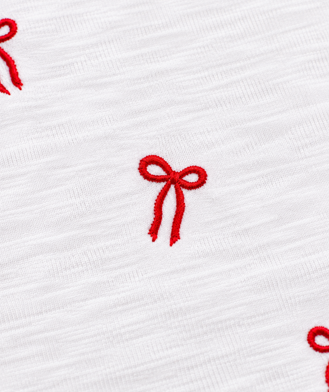 Close up of KatieJ NYC Tween Fearless Tee With Embroidered Red Bows
