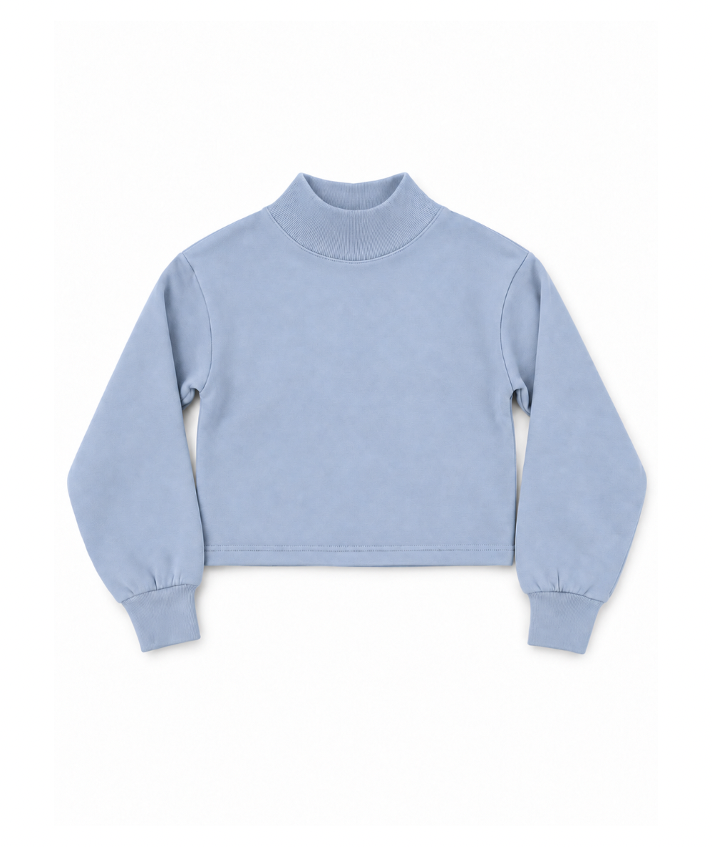 Front view of Vintage Havana Tween Weekend mock-neck sweatshirt in baby blue with long sleeves and a cropped boxy fit