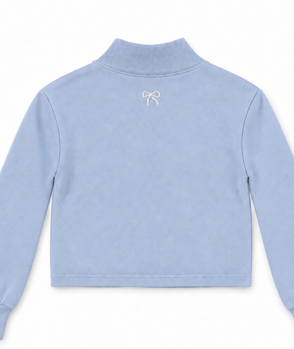 Back view of Vintage Havana Tween Weekend baby blue mock neck sweatshirt with a small embroidered bow