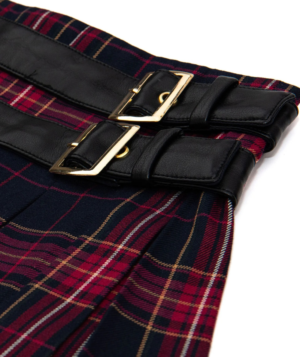 Close up detail of KatieJ NYC Tween Axel belted pleated mini skirt in Navy Berry Plaid with double black belt details, gold buckles, and built-in shorts.