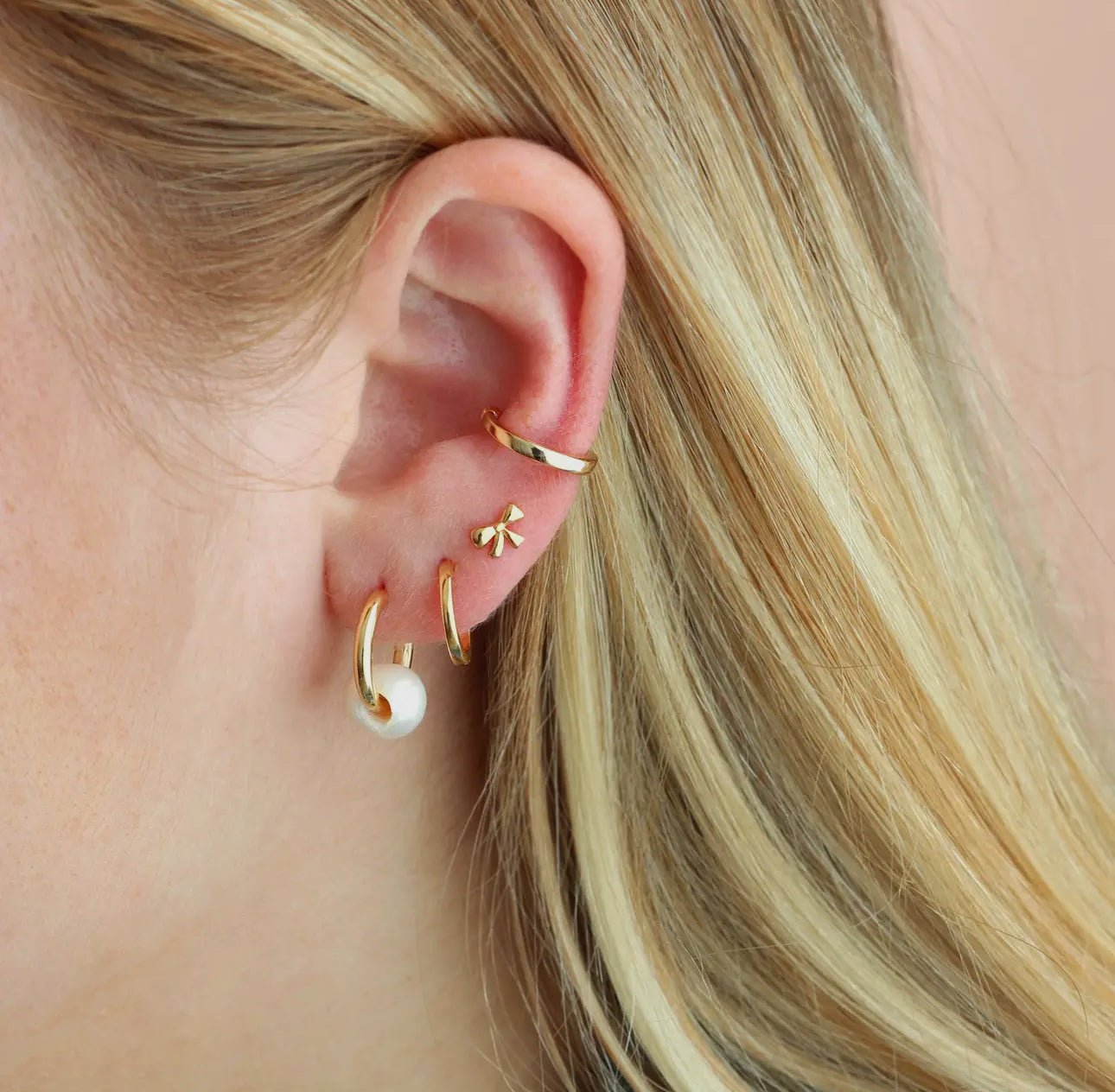 Model wearing Kris Nations Bow Stud Earrings - CAKEWISH