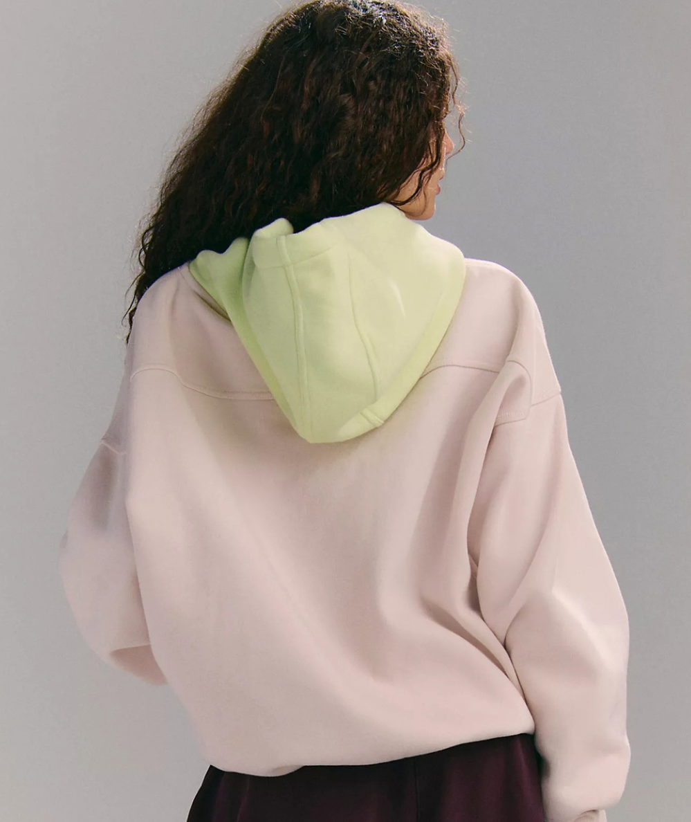 Back view of the FP Movement Final Call Colorblock Hoodie in Cream Combo, showing the pale lime hood and dropped shoulders.