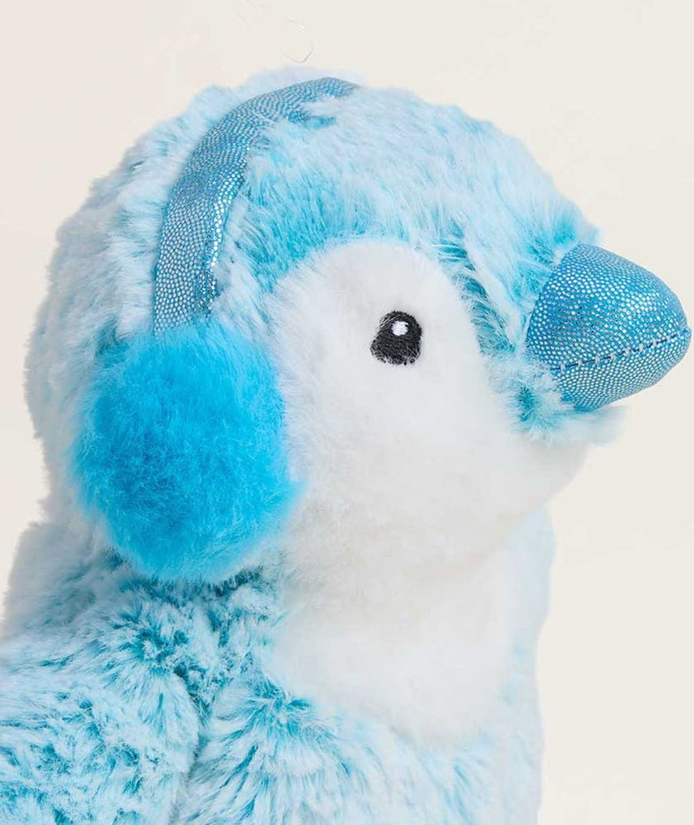 Side profile of the plush Junior Warmies penguin in soft blue and white fur - CAKEWISH.