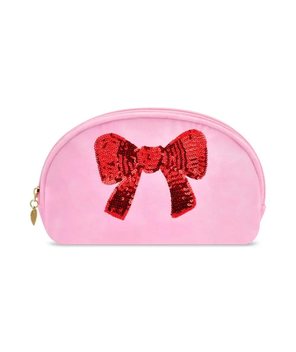 Pink oval cosmetic bag with a red sequin bow and gold zipper by Iscream - CAKEWISH.