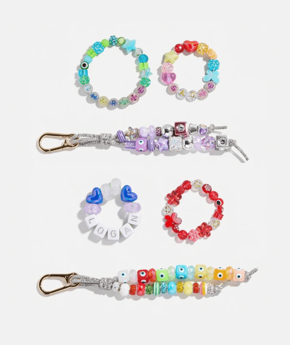 Finished bracelets and two beaded bag charms made with the Dream Duo kids' DIY kit.