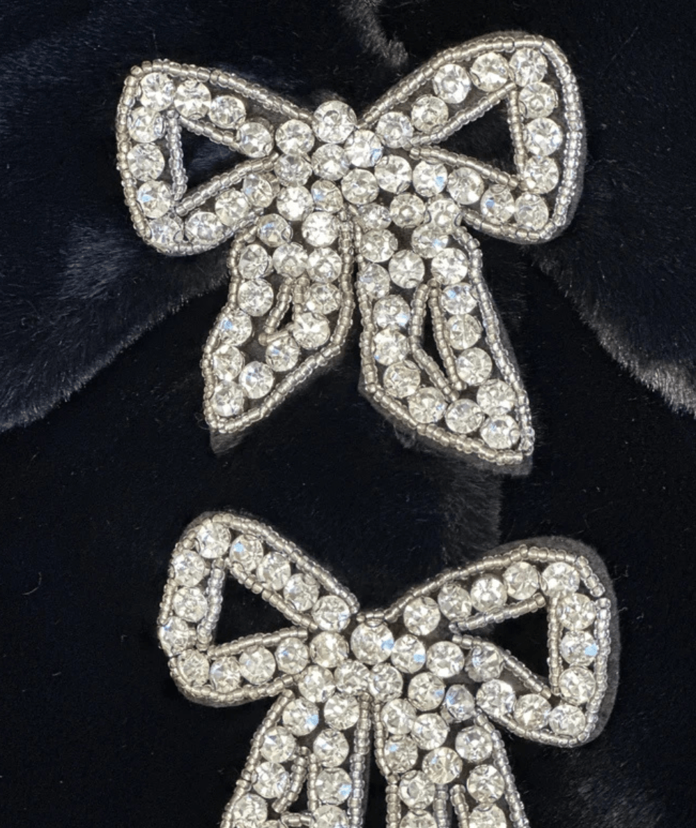 Close up of the Lola & the Boys Black Tween Audrey Faux Fur Coat with Rhinestone Bows - CAKEWISH