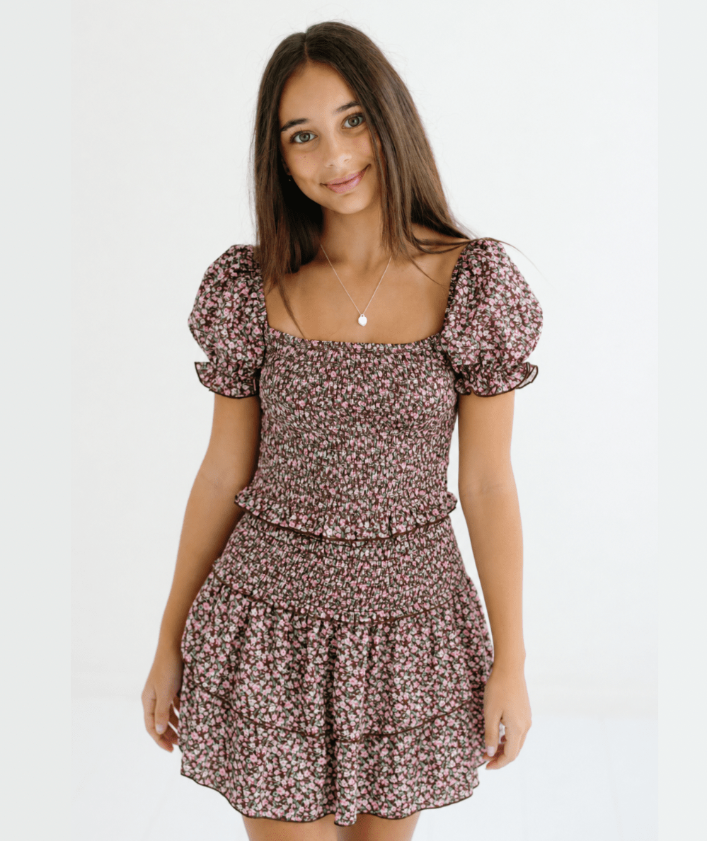 Model wearing the KatieJ NYC Tween Bianca Floral Tiered Satin Skirt in Espresso Floral - CAKEWISH