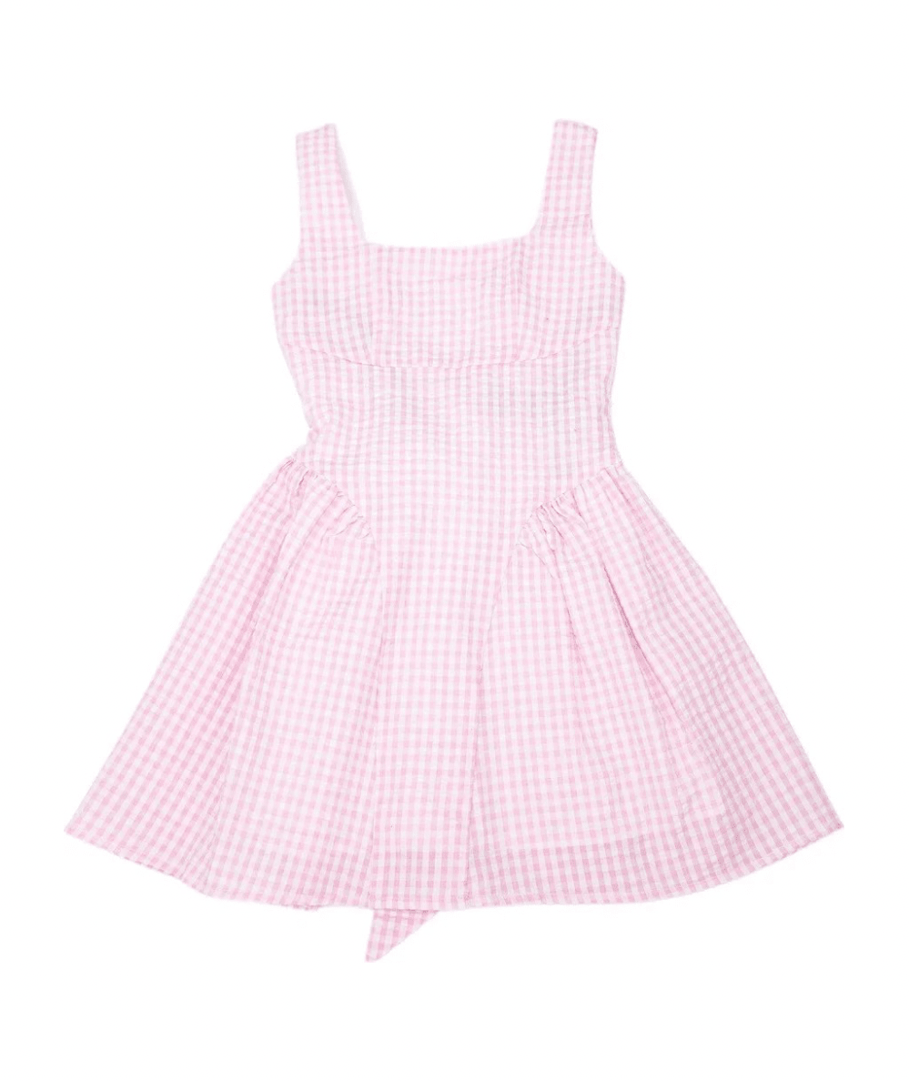 KatieJ NYC Tween Brenna Gingham Tie Back Dress in Pink features a soft pink and white gingham print, square neckline, wide shoulder straps, fitted bodice, and flared mini skirt. Made for tweens, this sleeveless summer dress is finished with a feminine tie-back detail and lightweight cotton fabric.