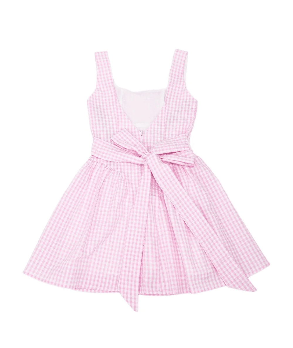 KatieJ NYC Tween Brenna Gingham Tie Back Dress in Pink with a feminine tie-back detail, square neckline, and flared mini skirt in a classic pink and white gingham print.