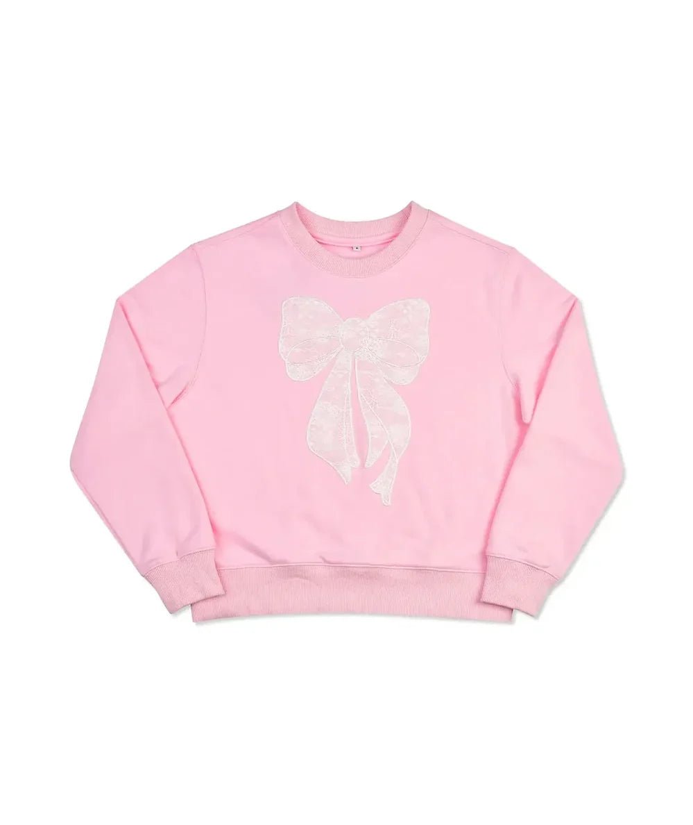 Pink crewneck sweatshirt with a big cream lace bow on the front for tweens, by Iscream - CAKEWISH