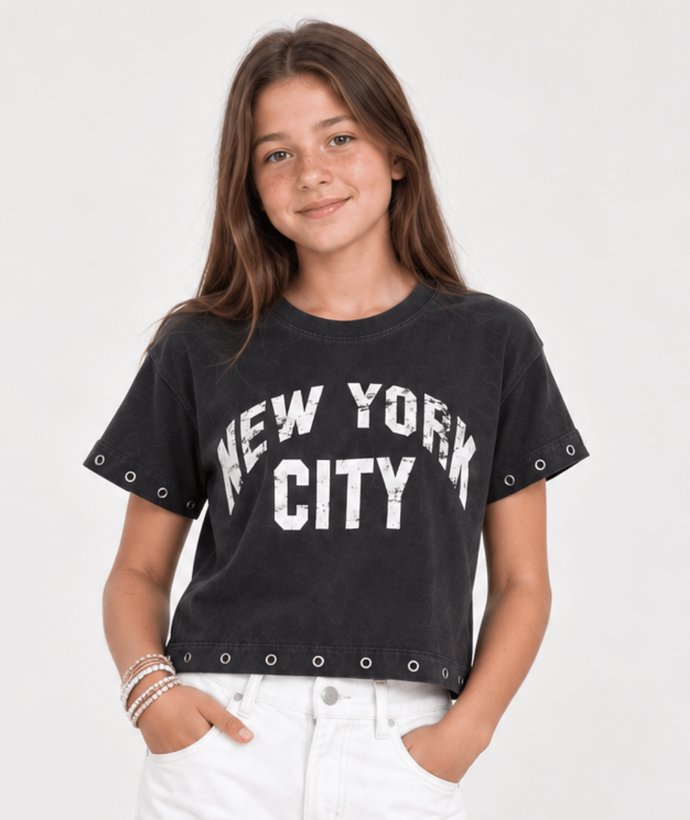 Model wearing the Vintage Havana Tween Madison NYC Grommet Trim Tee - CAKEWISH