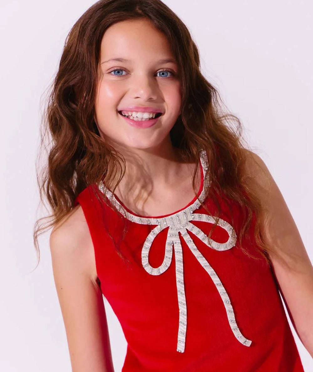 Close-up of a tween in the Lola and the Boys Red Velvet Bow Princess Dress - CAKEWISH