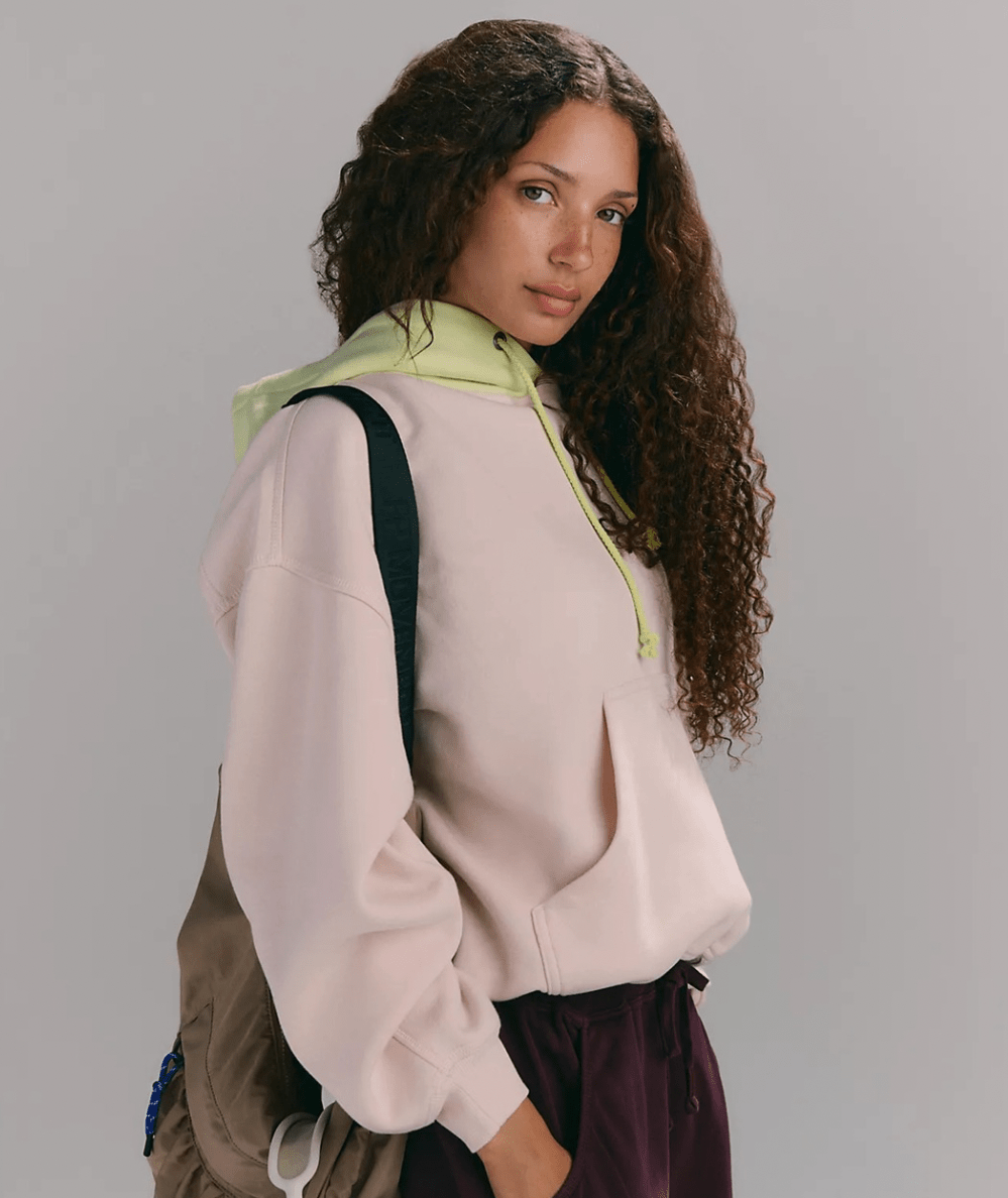 Model wearing the FP Movement Women’s Final Call ColorBlock Hoodie in Cream Combo - CAKEWISH