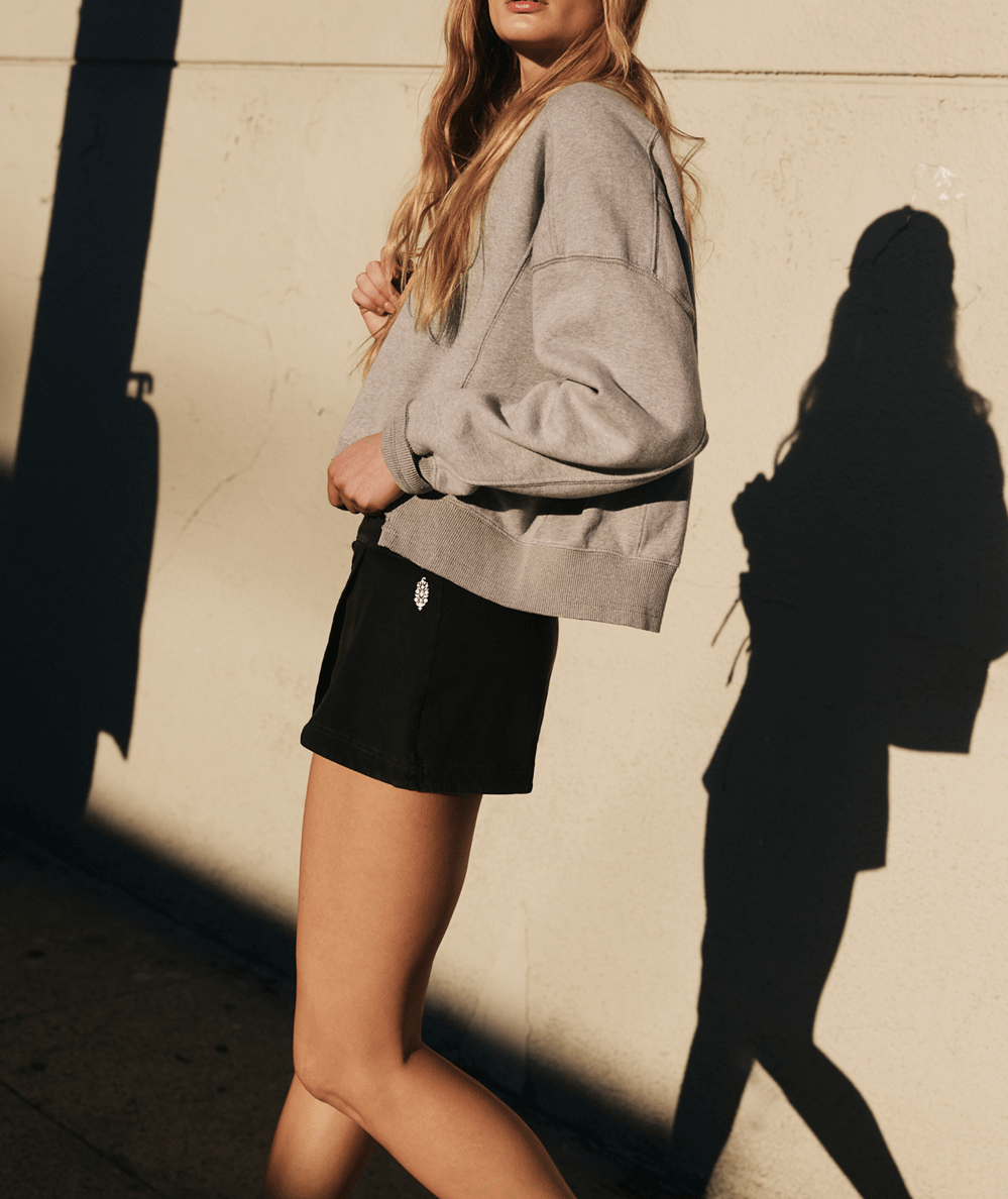 FP Movement Women’s Hot Shot Mini Skort in Black featuring stretchy, lightweight fabric - CAKEWISH.