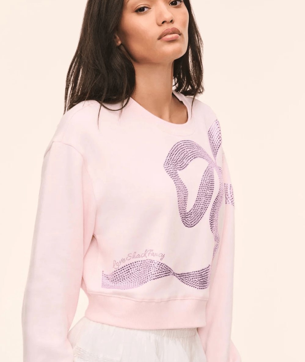 Side view of the LoveShackFancy Women’s Rylan Rhinestone Bow Pink Pullover Sweatshirt - CAKEWISH